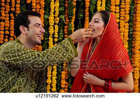 Feeding sweets View Large Photo Image Stock Image - Feeding sweets. Fotosearch