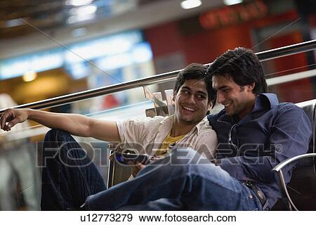 Friends at a mall View Large Photo Image Stock Photo - Friends at a mall. Fotosearch