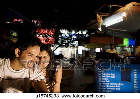 Stock Image - Friends at a market place. Fotosearch
