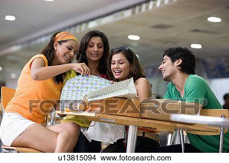 Friends enjoying View Large Photo Image Picture - Friends enjoying. Fotosearch
