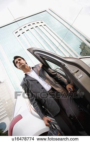 Getting out of a car View Large Photo Image Picture - Getting out of a car. Fotosearch
