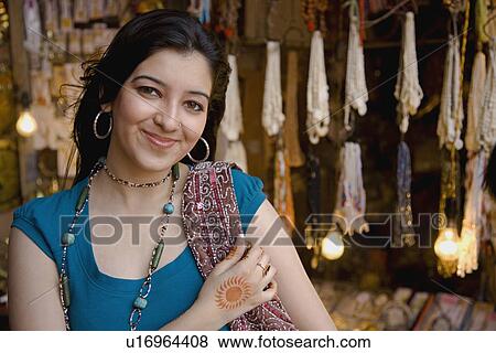Stock Photo - Girl in front of a shop. Fotosearch
