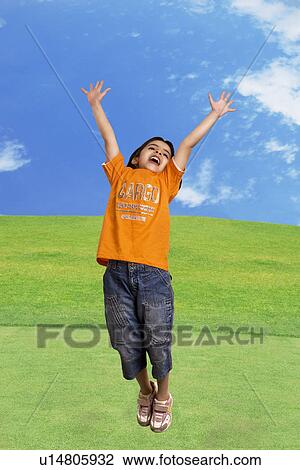 Stock Image - Girl jumping with joy. Fotosearch