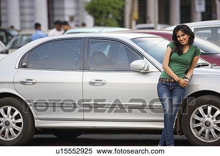 Stock Photography - Girl leaning on the car. Fotosearch