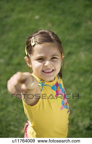 Stock Photo - Girl pointing a finger. Fotosearch