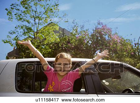 Girl raising her arms View Large Photo Image Stock Photo - Girl raising her arms. Fotosearch