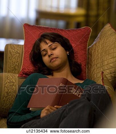 Girl resting on a couch View Large Photo Image Picture - Girl resting on a couch. Fotosearch