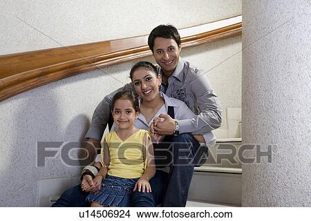 Picture - Girl with parents. Fotosearch