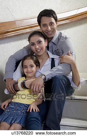 Stock Image - Girl with parents. Fotosearch