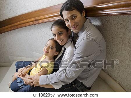 Stock Photo - Girl with parents. Fotosearch