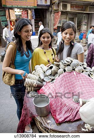 Picture - Girls having Faluda Kulfi. Fotosearch