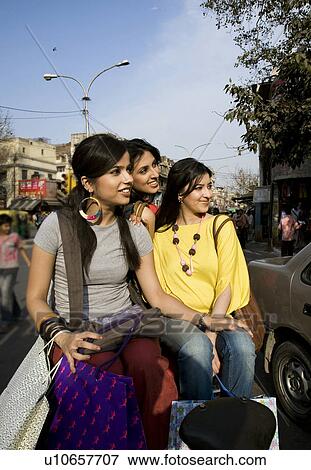 Stock Photo - Girls on a rickshaw. Fotosearch