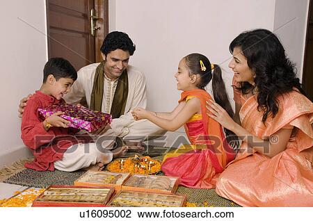 Stock Image - Giving presents. Fotosearch