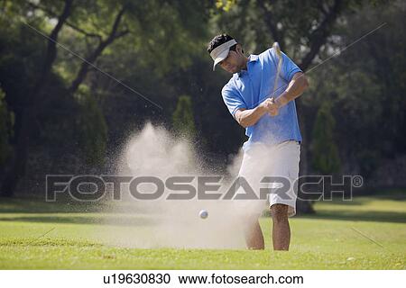 Golfer strikes off View Large Photo Image Stock Image - Golfer strikes off. Fotosearch