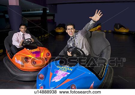 Having fun in bumper cars View Large Photo Image Stock Photo - Having fun in bumper cars. Fotosearch