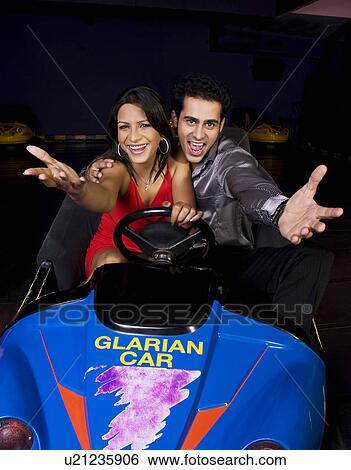Having fun in bumper cars View Large Photo Image Stock Photograph - Having fun in bumper cars. Fotosearch