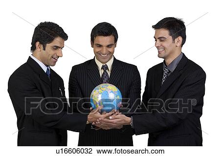 Holding a globe together View Large Photo Image Stock Image - Holding a globe together. Fotosearch