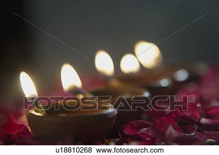 Stock Photo - Lighted diyas. Fotosearch