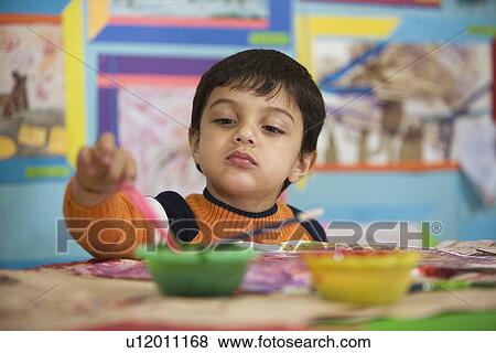 Little boy painting View Large Photo Image Stock Photo - Little boy painting. Fotosearch