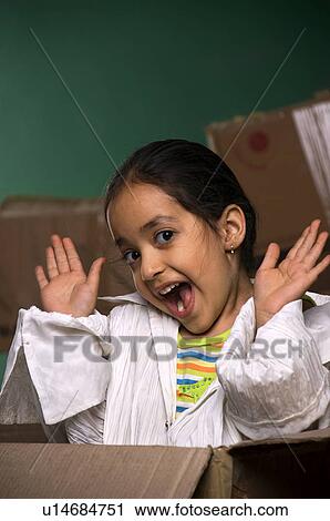 Little girl in a cardboard box View Large Photo Image Stock Image - Little girl in a cardboard box. Fotosearch