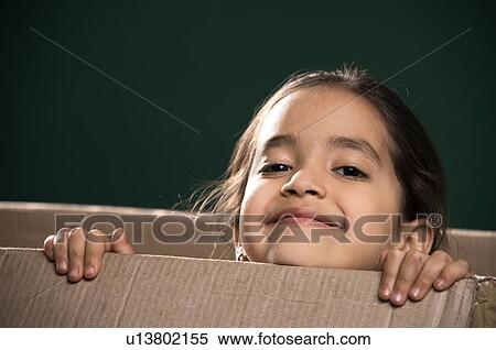 Little girl in a cardboard box View Large Photo Image Stock Photography - Little girl in a cardboard box. Fotosearch