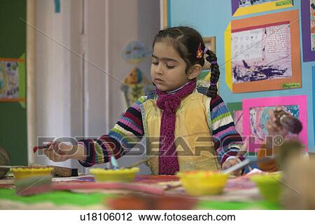 Little girl painting View Large Photo Image Stock Image - Little girl painting. Fotosearch