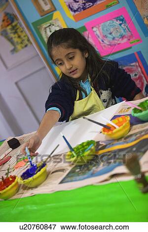 Little girl painting View Large Photo Image Stock Photo - Little girl painting. Fotosearch