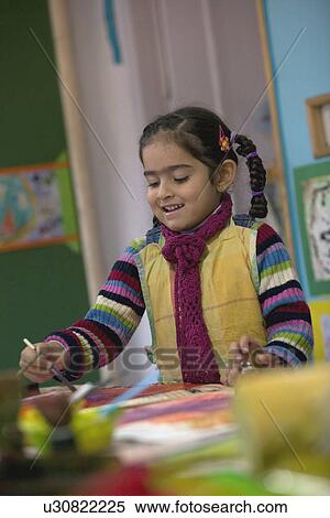 Stock Photography - Little girl painting. Fotosearch