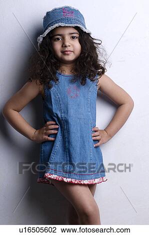 Stock Image - Little girl striking a pose. Fotosearch