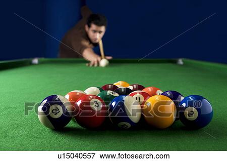 Stock Photo - Man about to break billiard balls. Fotosearch