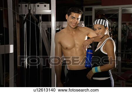 Man and woman at the gym View Large Photo Image Stock Image - Man and woman at the gym. Fotosearch
