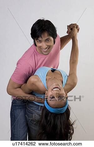 Stock Image - Man and woman dancing. Fotosearch