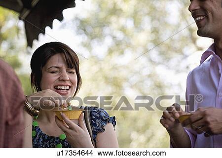 Man and woman having street food View Large Photo Image Picture - Man and woman having street food. Fotosearch