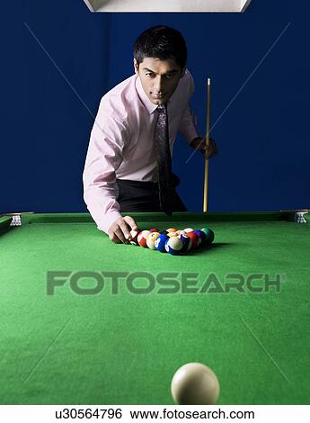 Man arranging billiard balls View Large Photo Image Stock Photograph - Man arranging billiard balls. Fotosearch