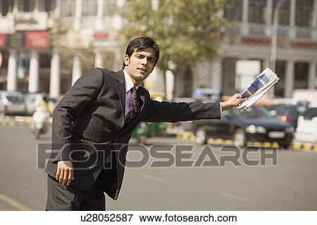 Stock Photo - Man asking for a lift. Fotosearch