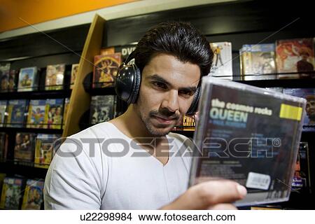 Man at a music store View Large Photo Image Picture - Man at a music store. Fotosearch