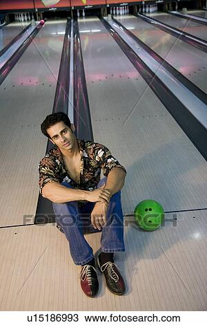 Stock Image - Man at the bowling alley. Fotosearch