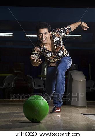 Man bowling View Large Photo Image Stock Image - Man bowling. Fotosearch