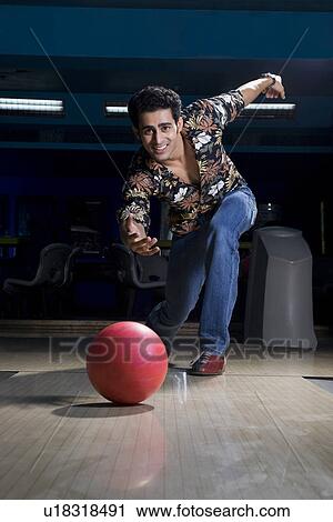 Stock Image - Man bowling. Fotosearch