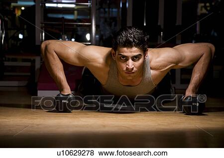Man doing push-ups View Large Photo Image Stock Photo - Man doing push-ups. Fotosearch