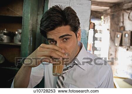 Man having tea View Large Photo Image Stock Image - Man having tea. Fotosearch
