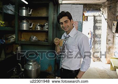 Man having tea View Large Photo Image Stock Photo - Man having tea. Fotosearch