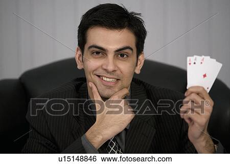 Man holding three aces View Large Photo Image Stock Photograph - Man holding three aces. Fotosearch