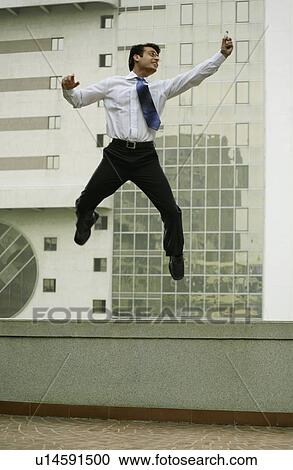 Stock Image - Man jumping in joy. Fotosearch