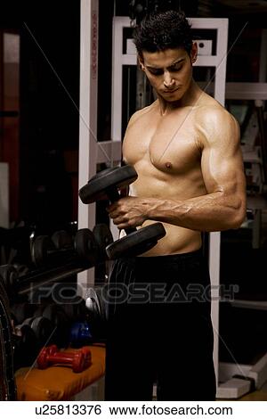 Stock Photograph - Man lifting weights. Fotosearch