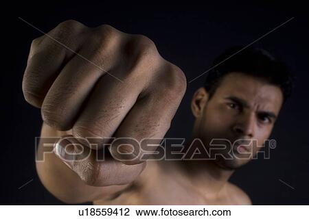 Stock Image - Man making a fist. Fotosearch
