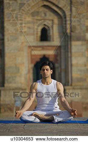 Stock Image - Man meditating. Fotosearch