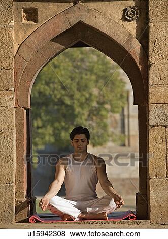 Man meditating View Large Photo Image Stock Photo - Man meditating. Fotosearch