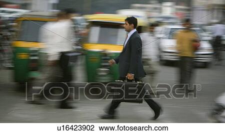 Stock Image - Man on the road. Fotosearch