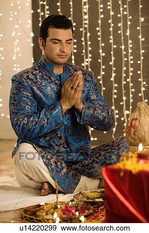 Stock Photo - Man performing a pooja. Fotosearch